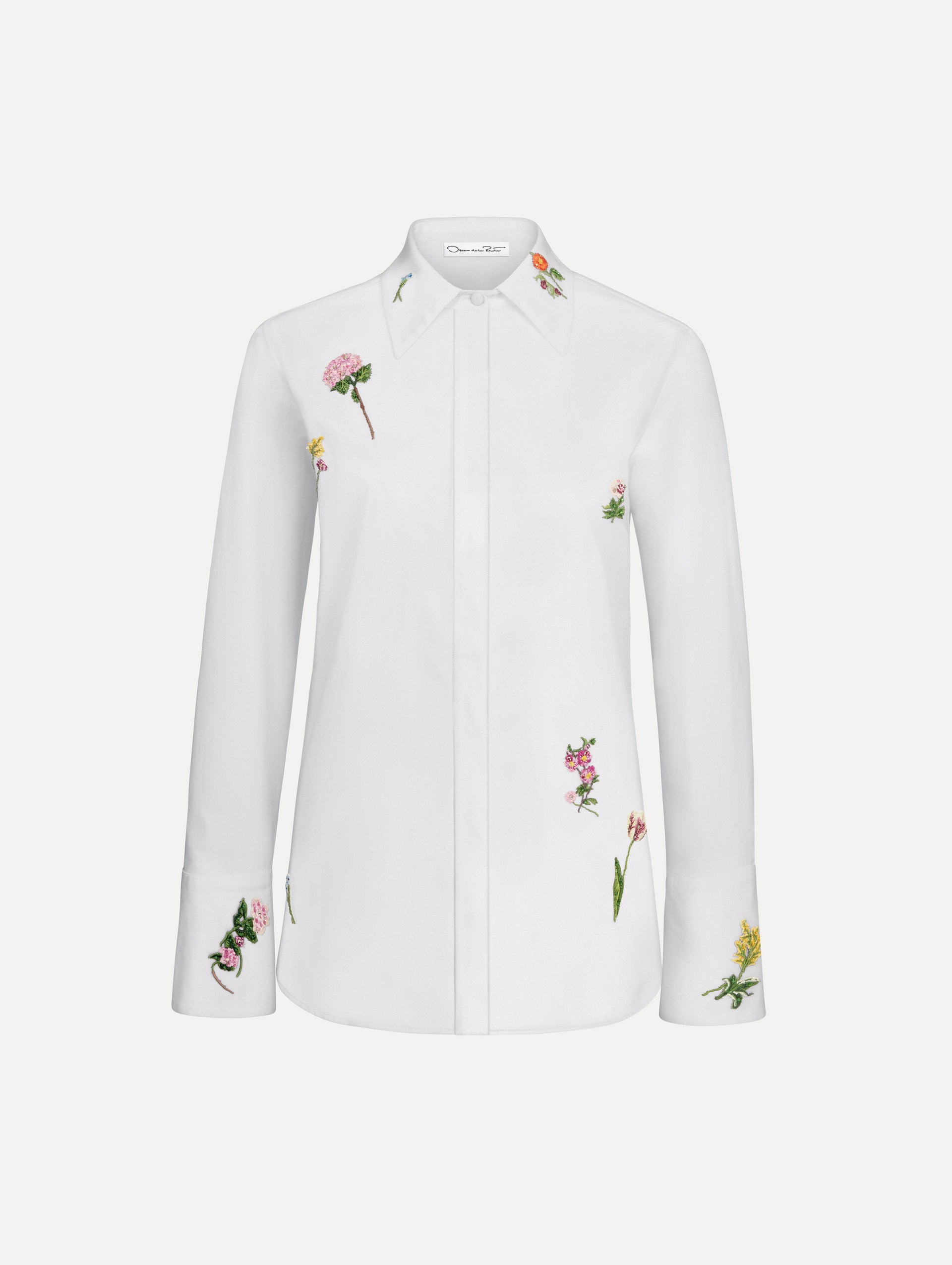 The model is wearing the beaded mixed botanical stretch twill blouse with long sleeves in the color white.
