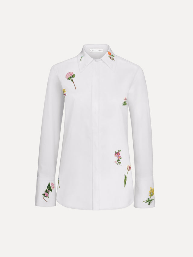 The model is wearing the beaded mixed botanical stretch twill blouse with long sleeves in the color white.