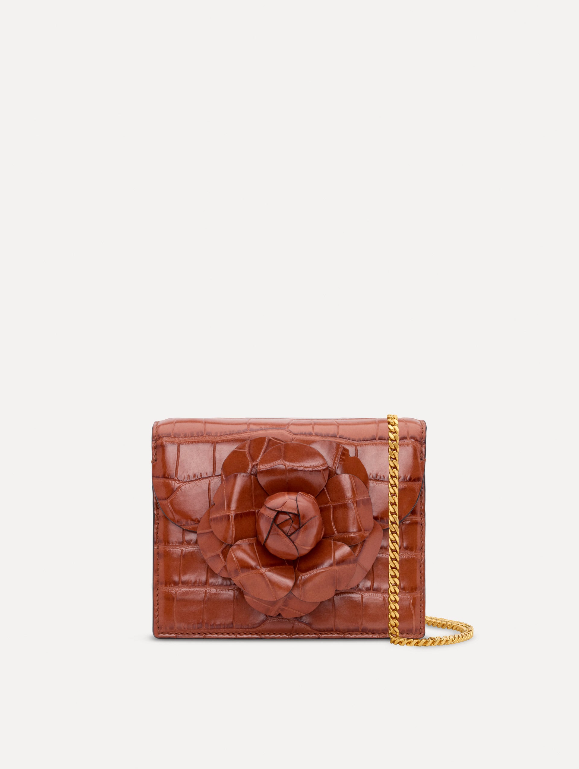 The Embossed Mini TRO Bag in the color cognac. Front view. 