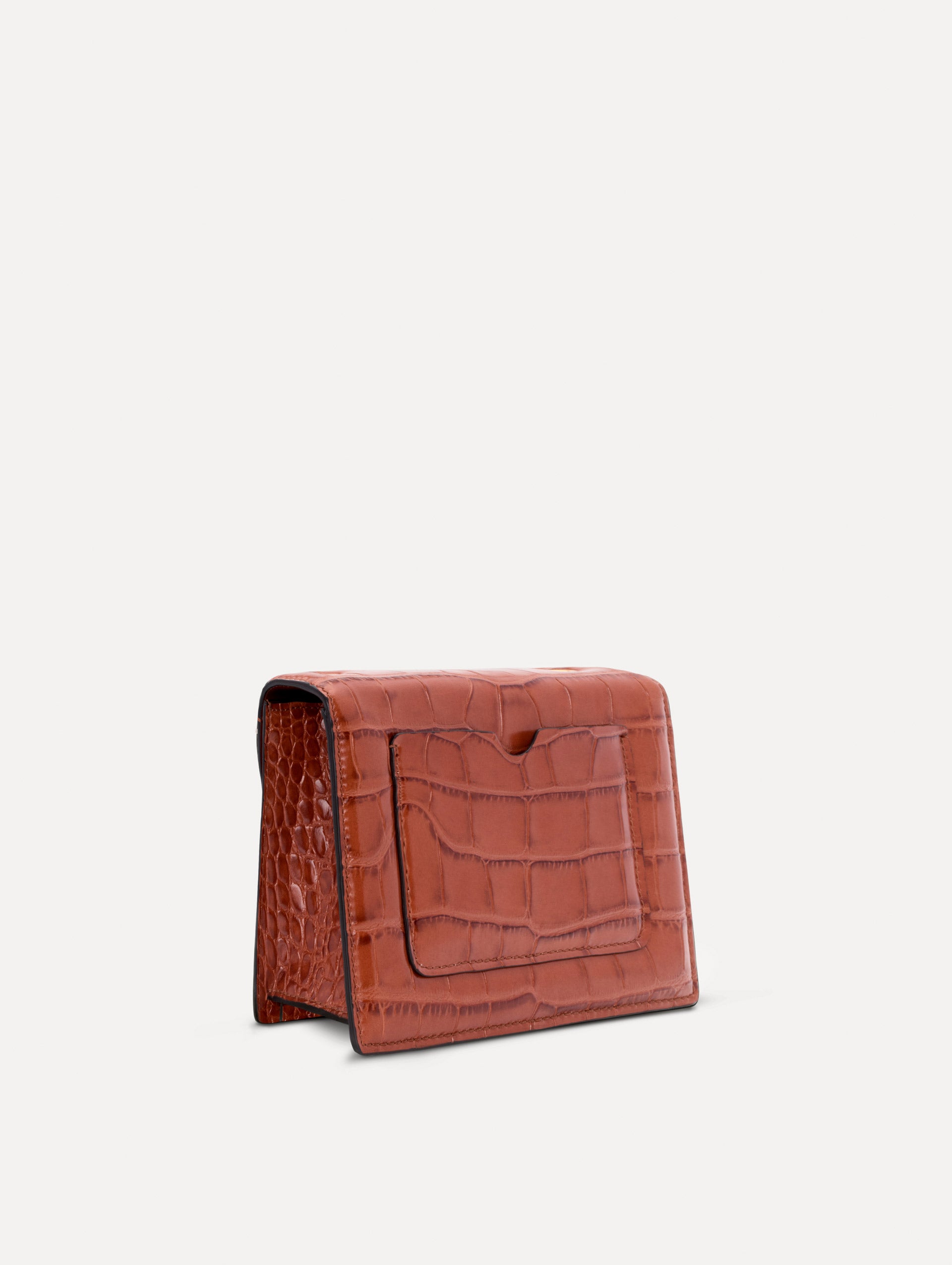 The Embossed Mini TRO Bag in the color cognac. Back view. 