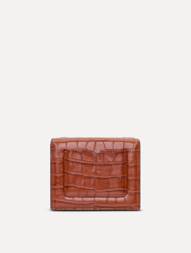 The Embossed Mini TRO Bag in the color cognac. Back view. 