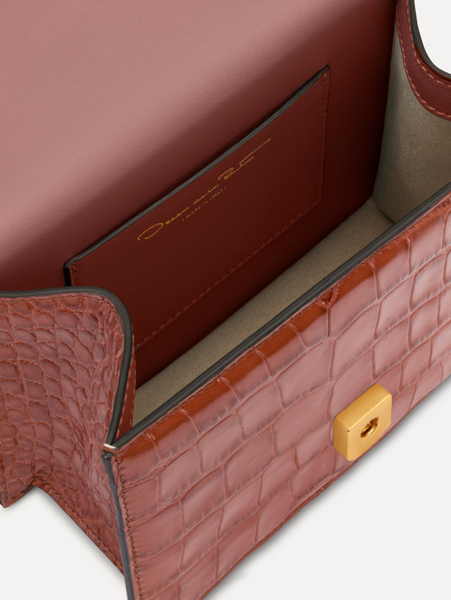 The Embossed Mini TRO Bag in the color cognac. Zoom view. 