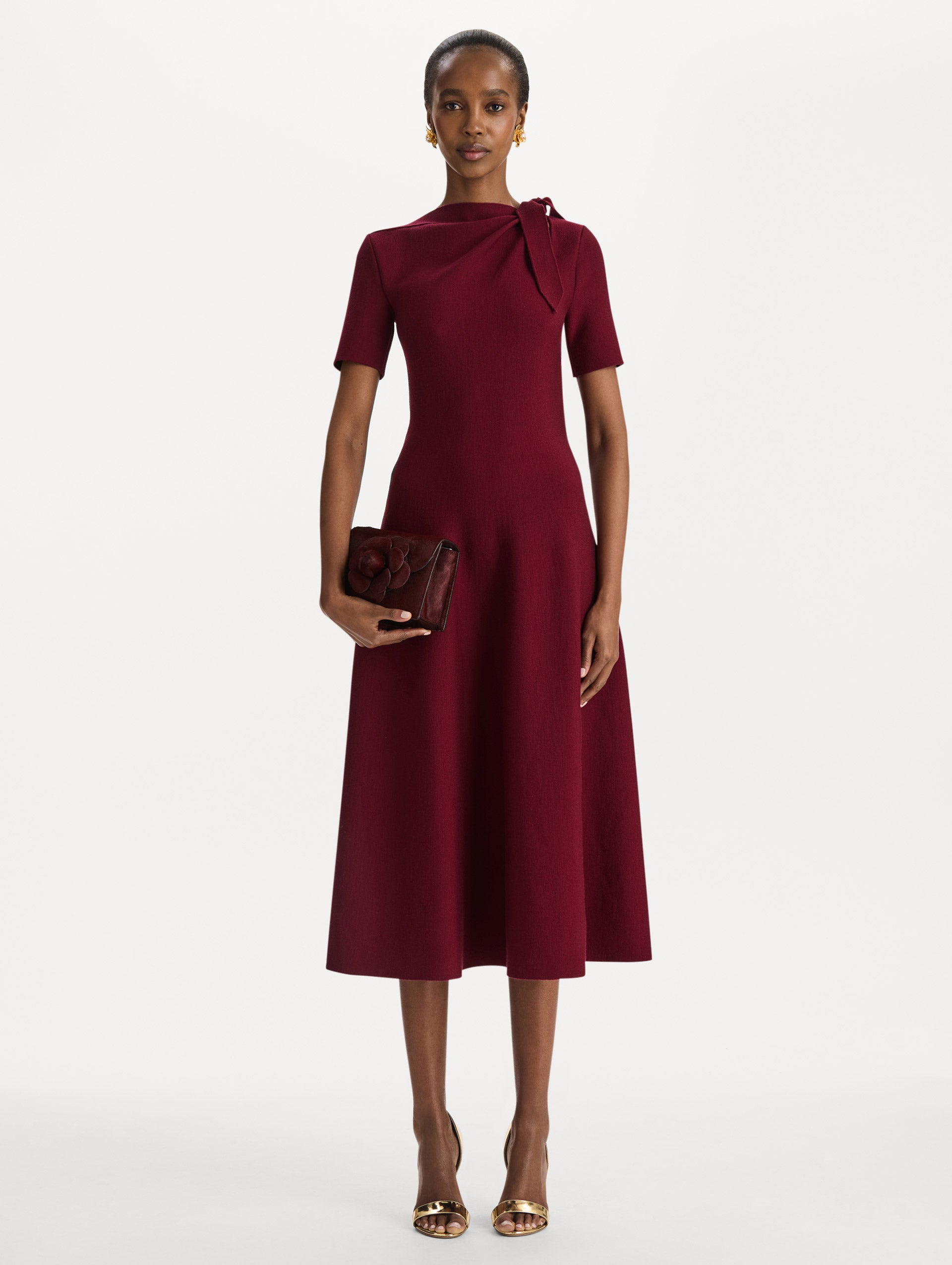 The Haircalf Mini TRO Bag in the color bordeaux. Front view.