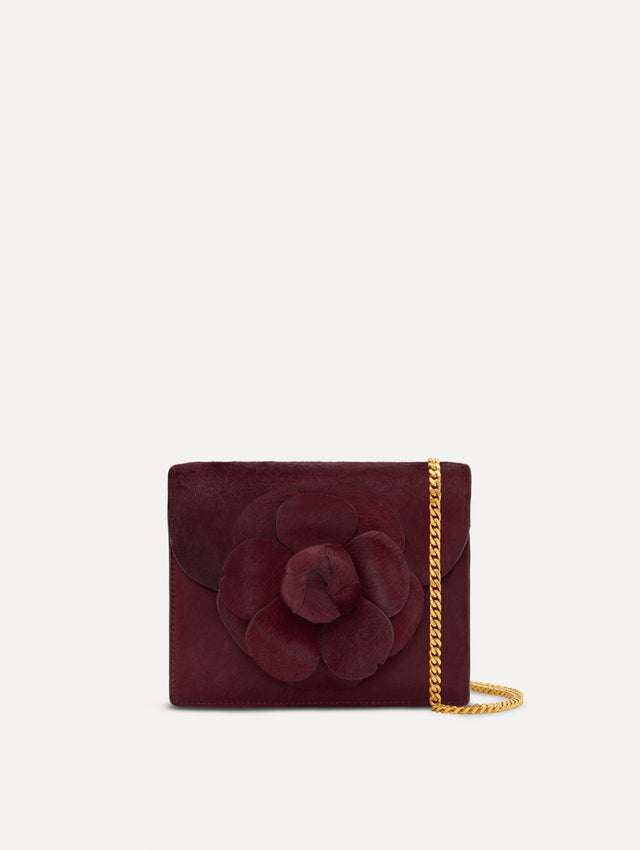 The Haircalf Mini TRO Bag in the color bordeaux. Front view.