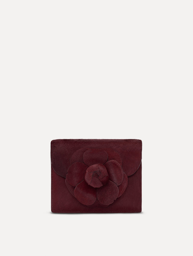 The Haircalf Mini TRO Bag in the color bordeaux. Front view.