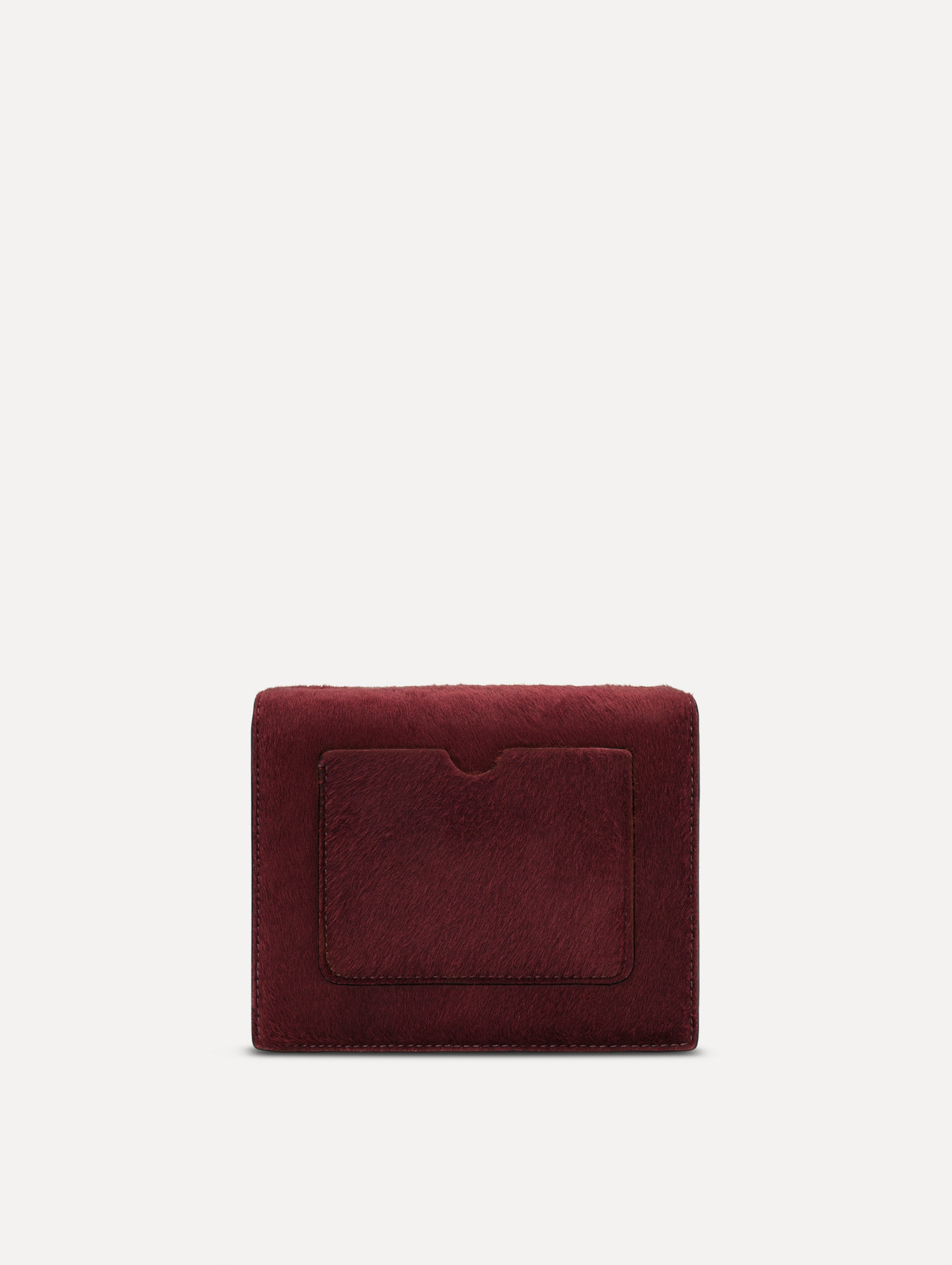 The Haircalf Mini TRO Bag in the color bordeaux. Back view.