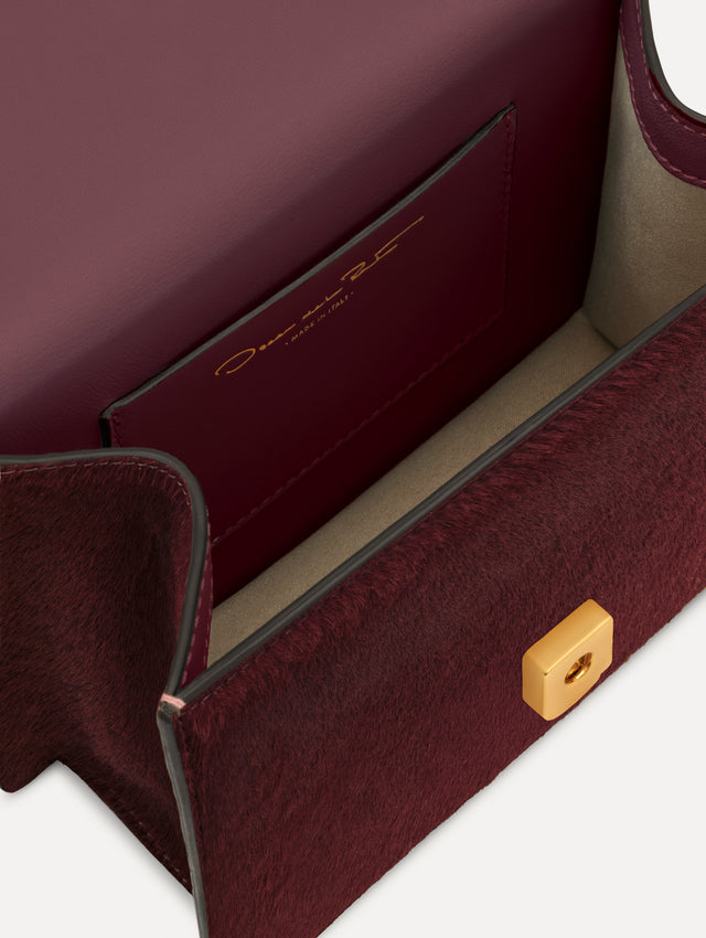 The Haircalf Mini TRO Bag in the color bordeaux. Zoom view.
