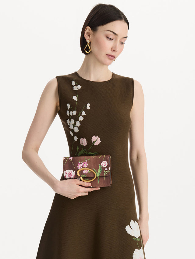 The Mixed Botanical Printed O Pochette in the color brown. Front view.