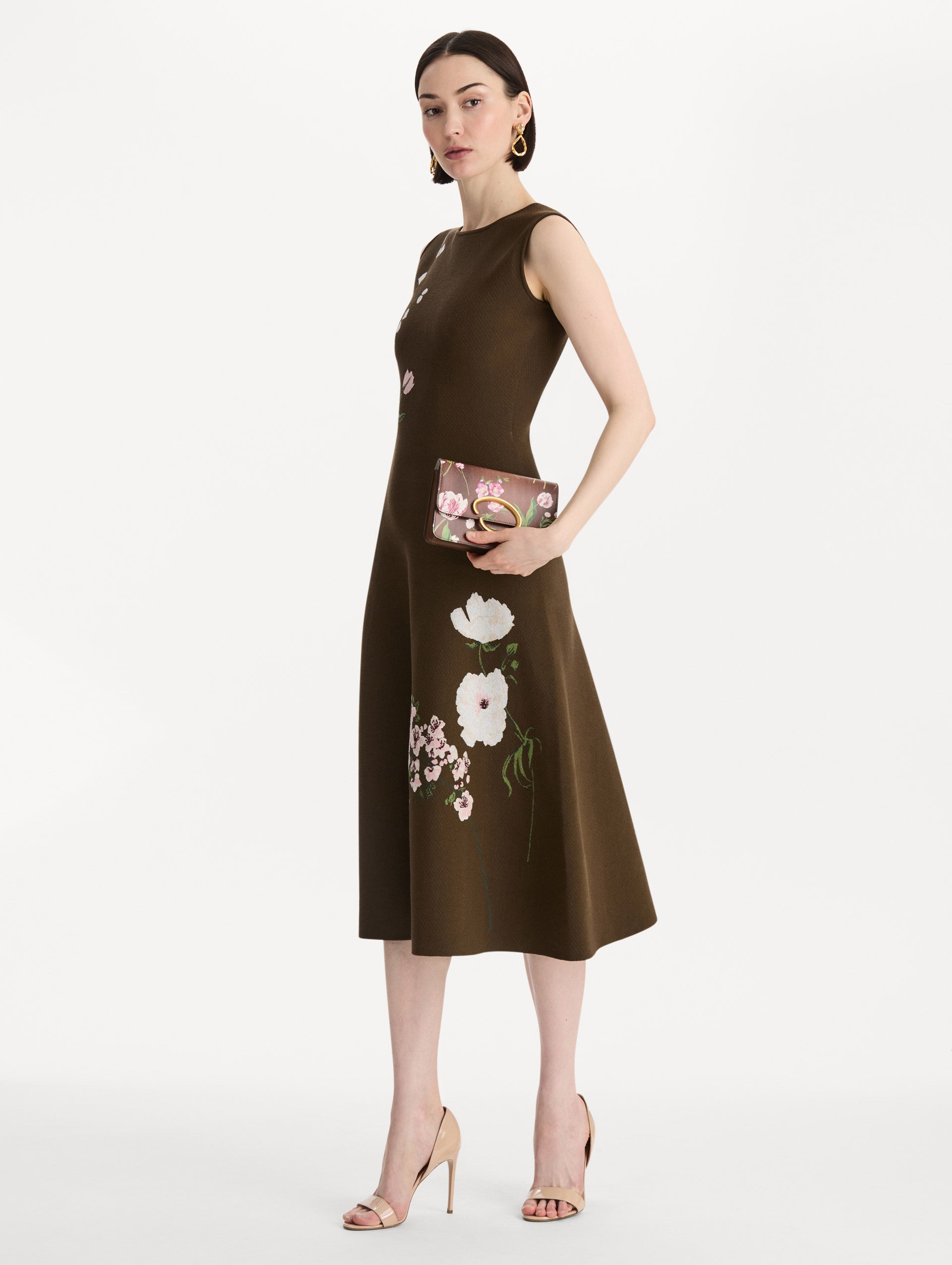 The Mixed Botanical Printed O Pochette in the color brown. Front view.