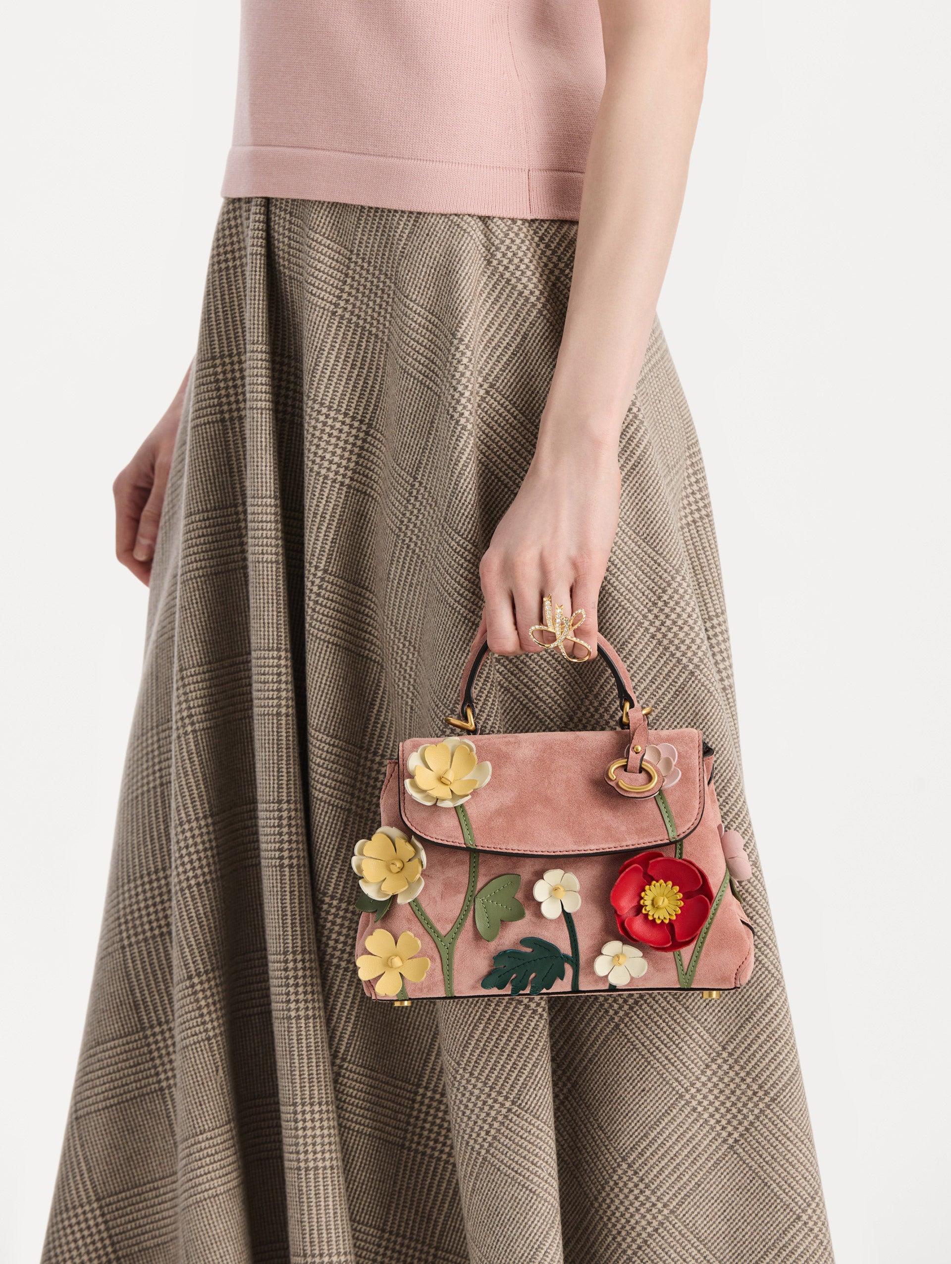 The Mini Poppy in Suede in the color blush. Front view.