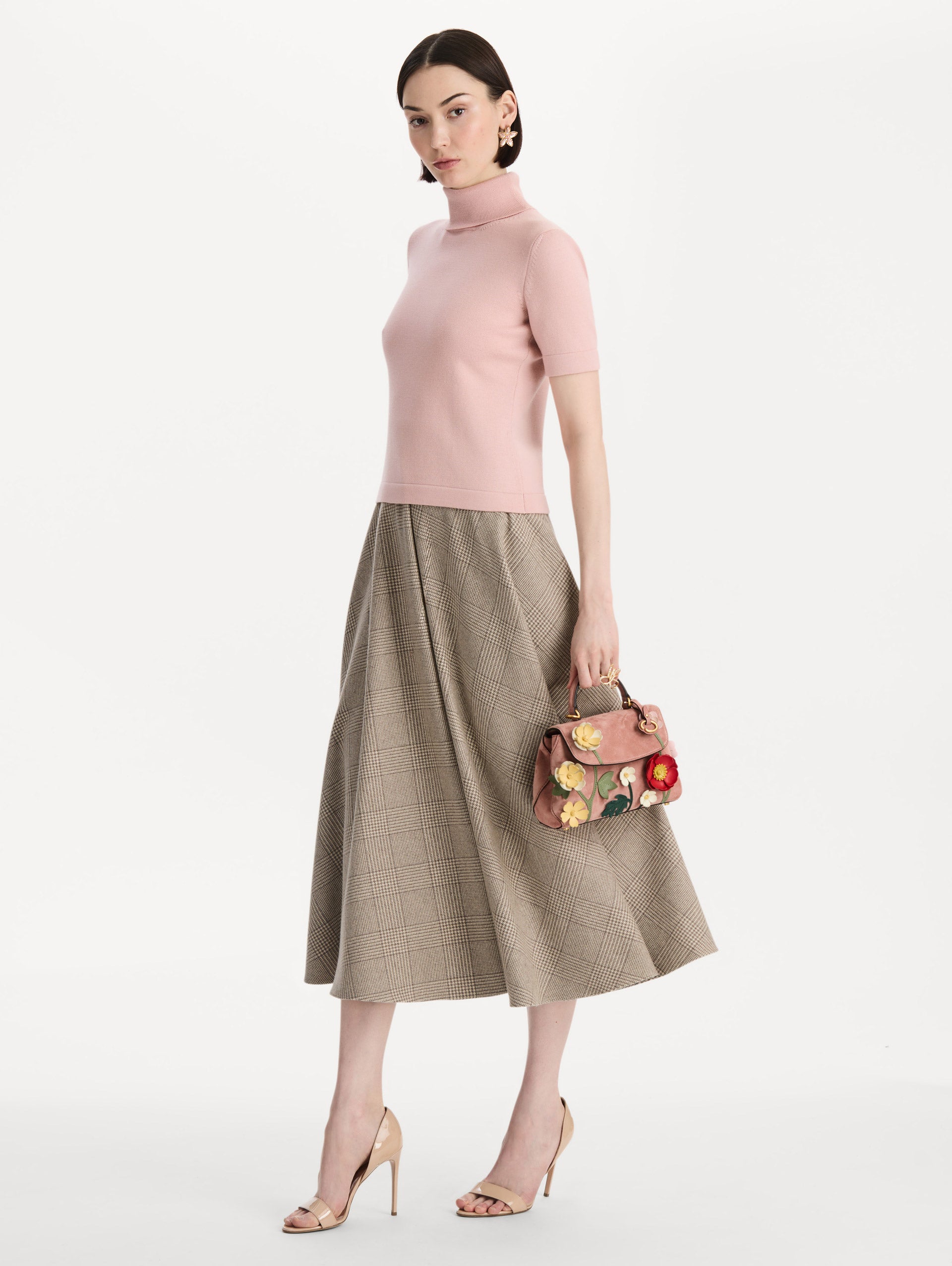 The Mini Poppy in Suede in the color blush. Front view.