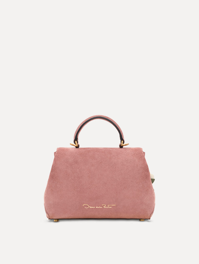 The Mini Poppy in Suede in the color blush. Back view.