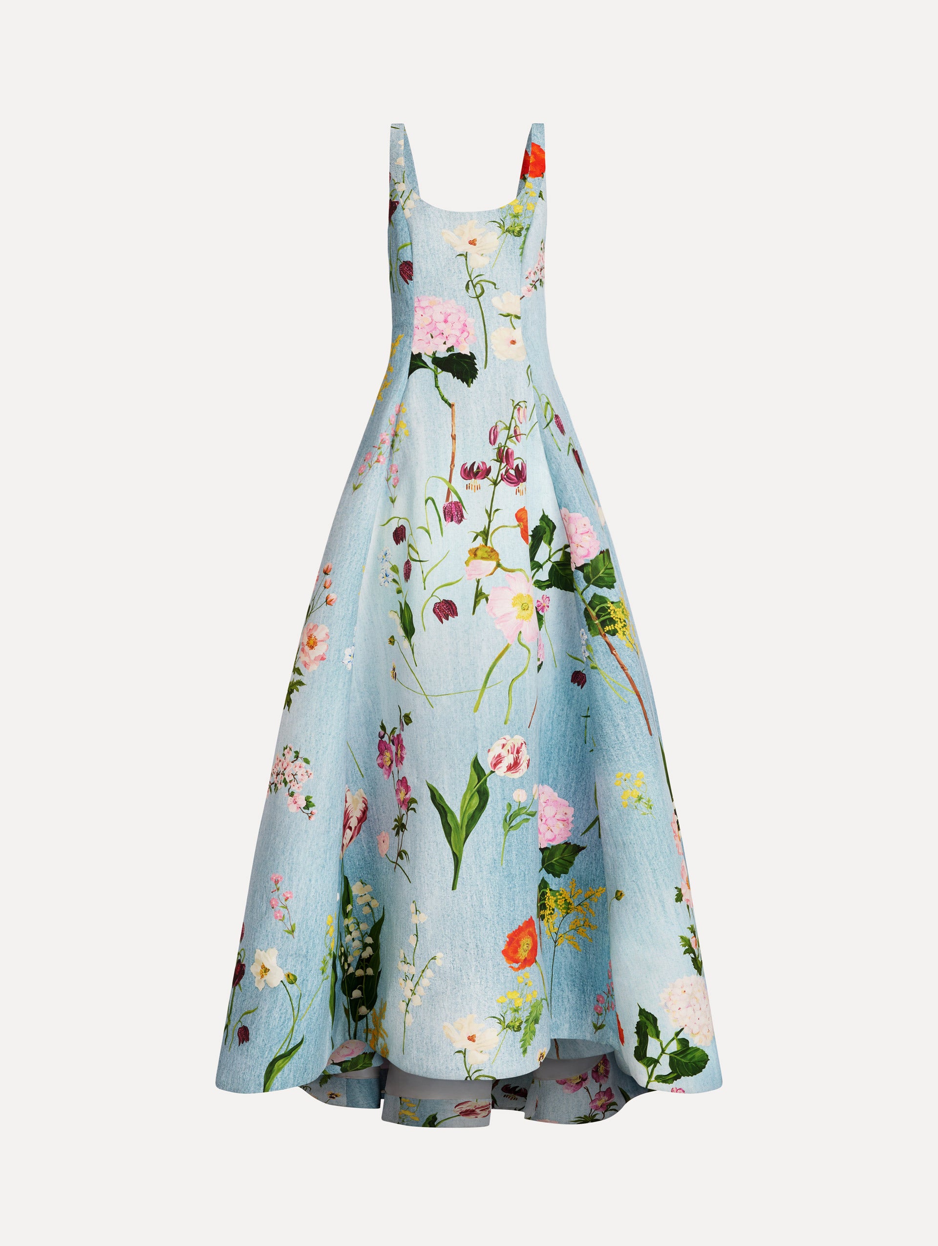 The model is wearing the mixed botanical faille gown with a sleeveless scoop neckline and a bold floral print in blue multi. 