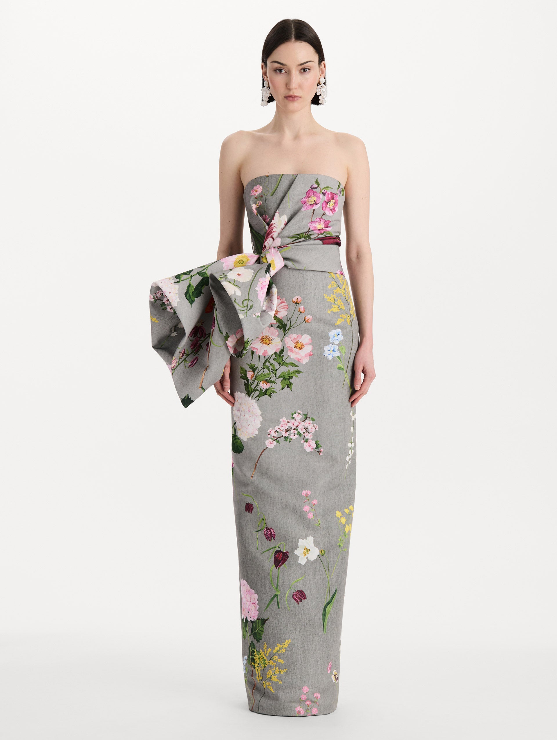 The model is wearing the mixed botanical drape-detailed faille gown with a strapless silhouette in the color grey multi. Front view. 