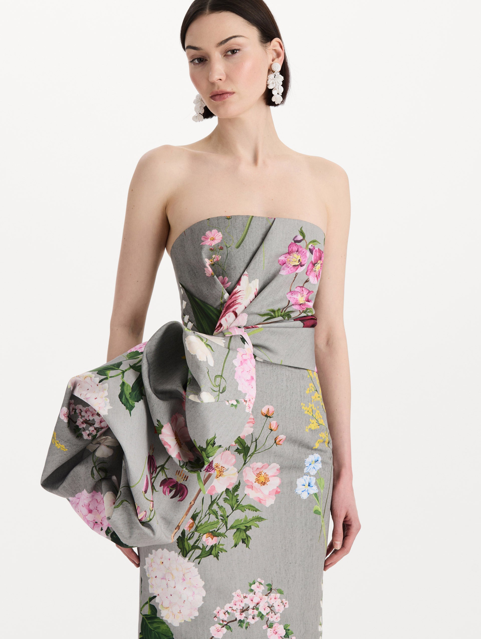 The model is wearing the mixed botanical drape-detailed faille gown with a strapless silhouette in the color grey multi. Zoom view. 