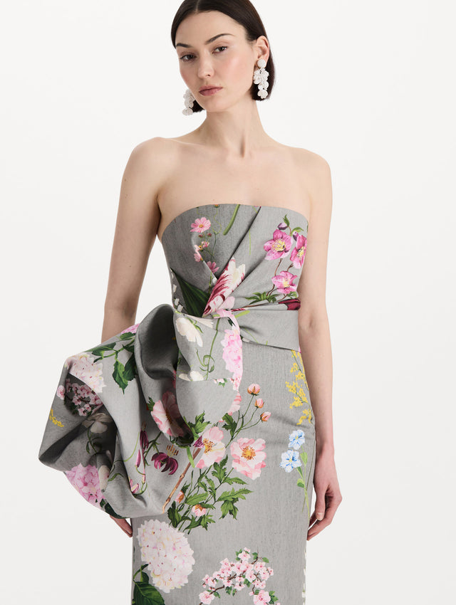 The model is wearing the mixed botanical drape-detailed faille gown with a strapless silhouette in the color grey multi. Zoom view. 