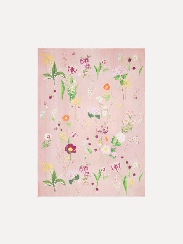 The model is wearing the mixed botanical scarf with an all-over floral print in the color pink multi. Front view. 