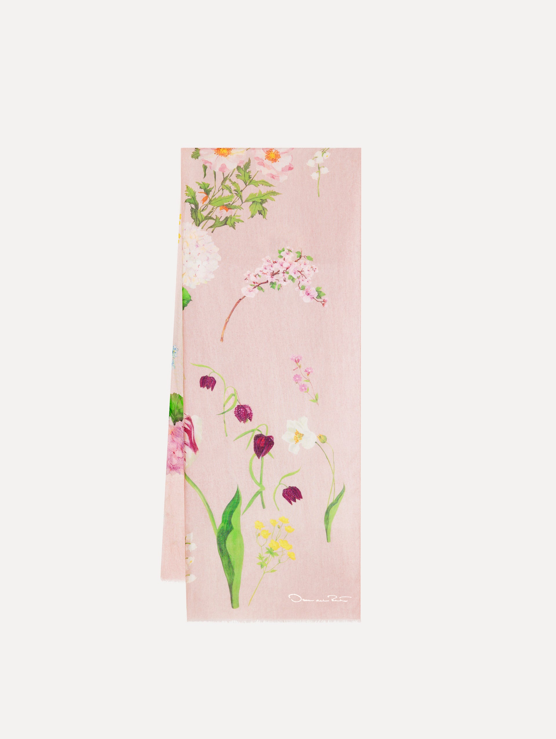 The model is wearing the mixed botanical scarf with an all-over floral print in the color pink multi.