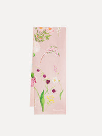 The model is wearing the mixed botanical scarf with an all-over floral print in the color pink multi.