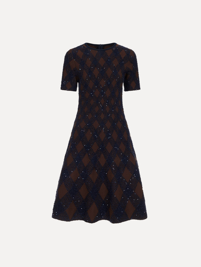 The model is wearing the argyle knit dress with a fit-and-flare silhouette in navy and brown.