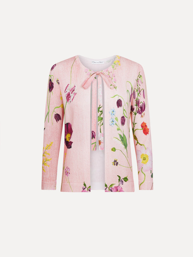 The model is wearing the mixed botanical tie-neck cardigan with an all-over floral print in blush multi. 