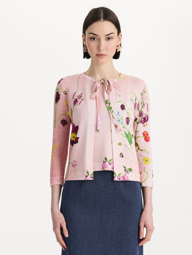 The model is wearing the mixed botanical tie-neck cardigan with an all-over floral print in blush multi. Front view.