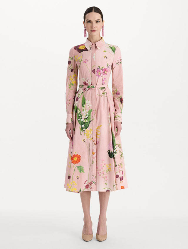 The model is wearing the mixed botanical cotton poplin dress with a collared neckline, long sleeves, and an all-over floral print in blush multi. Front view. 