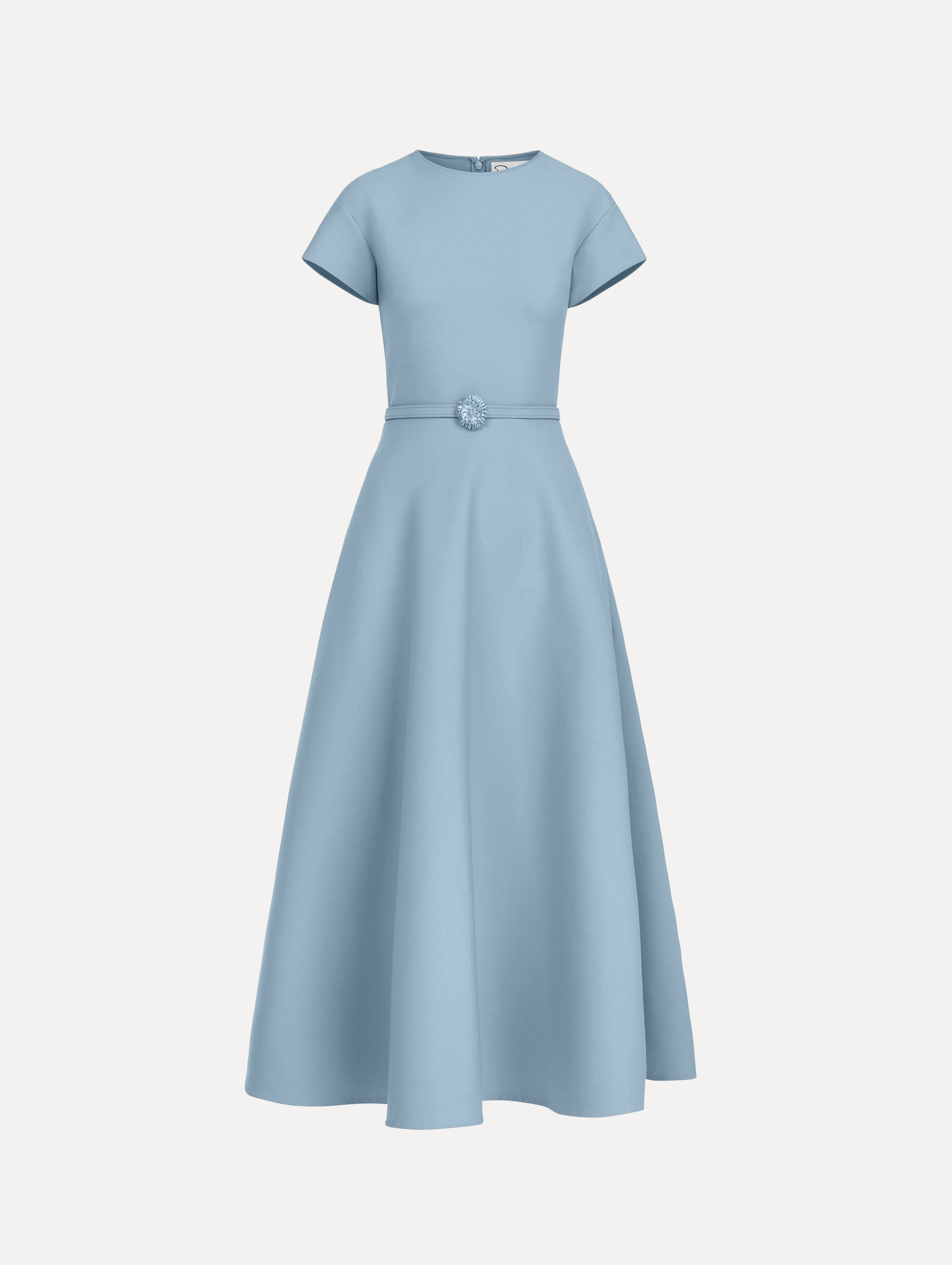 The model is wearing the wool cap sleeve dress in the color talc blue.