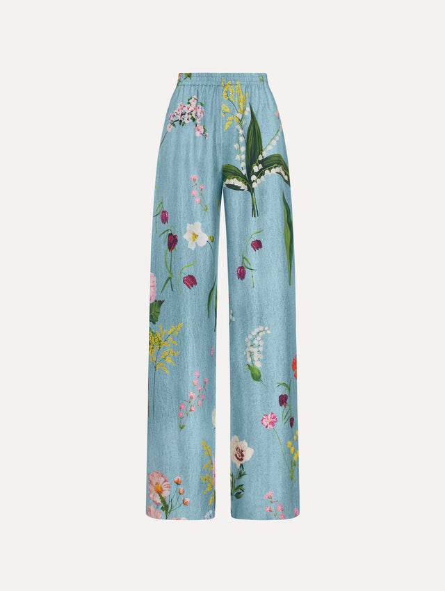 The model is wearing the mixed botanical silk twill pant in the color blue multi.