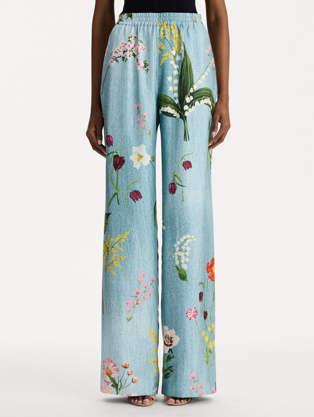 The model is wearing the mixed botanical silk twill pant in the color blue multi. Front view.