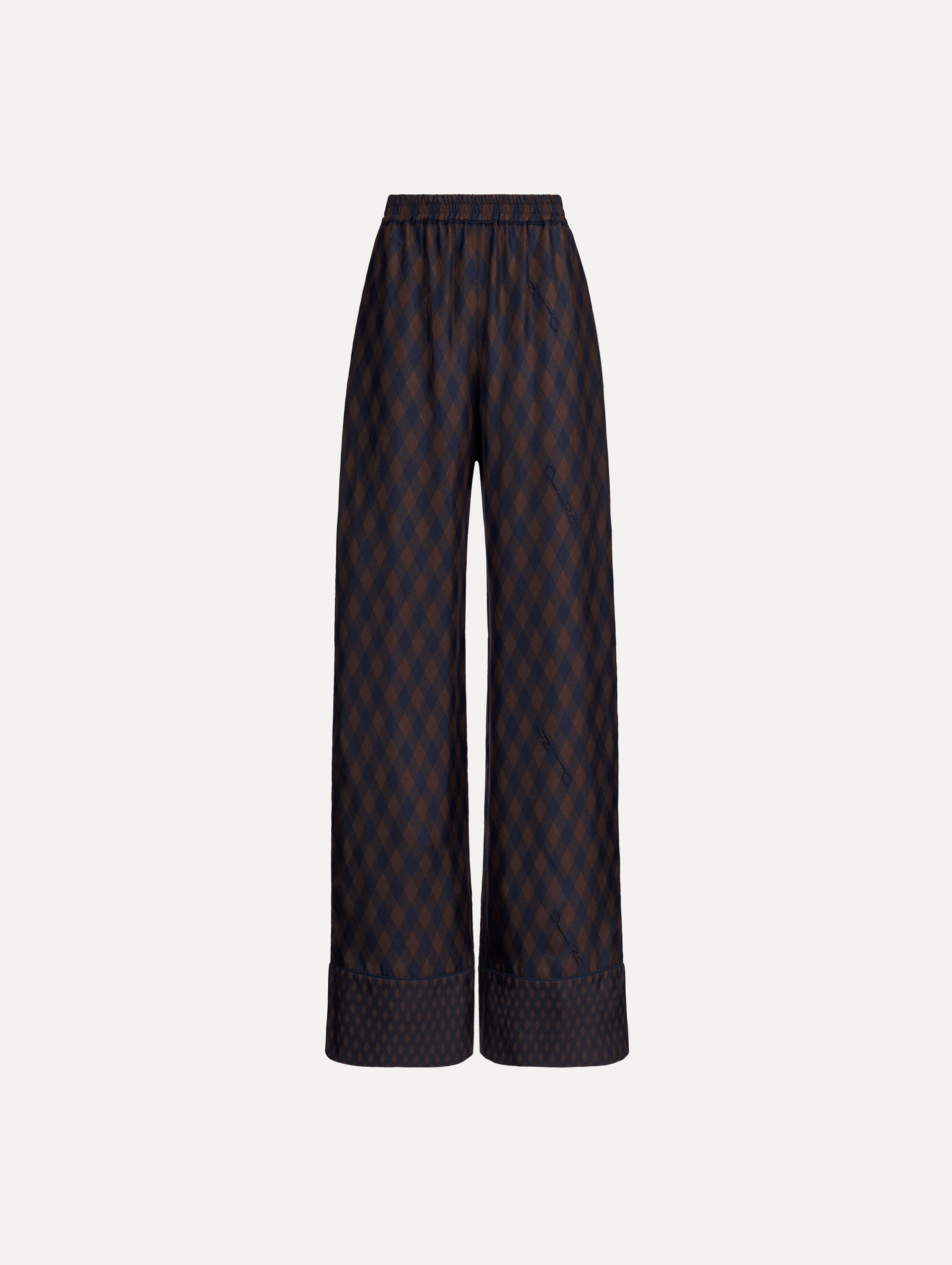 The model is wearing the Argyle Silk Twill Wide Leg Pant in navy and brown. 