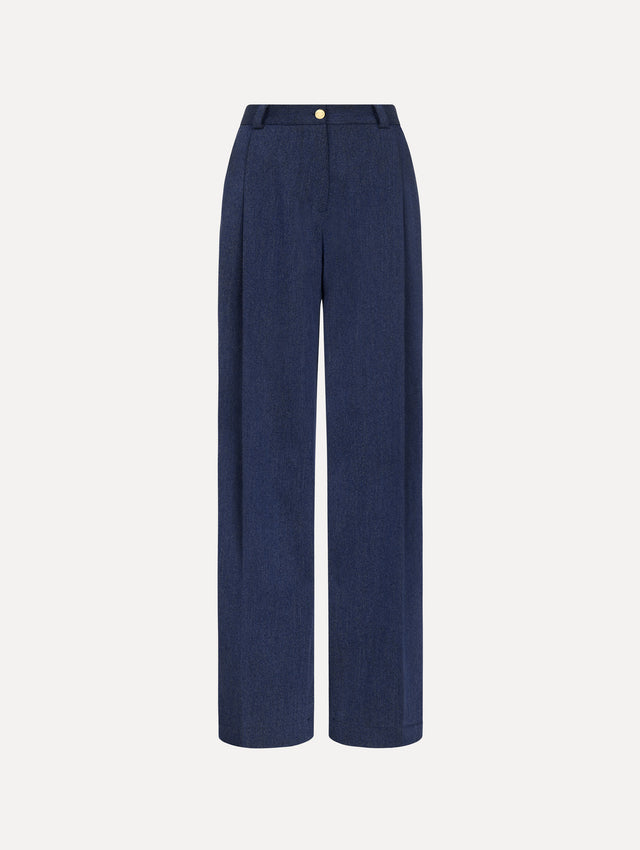 Model wearing indigo wool drill trousers with a straight-leg silhouette.