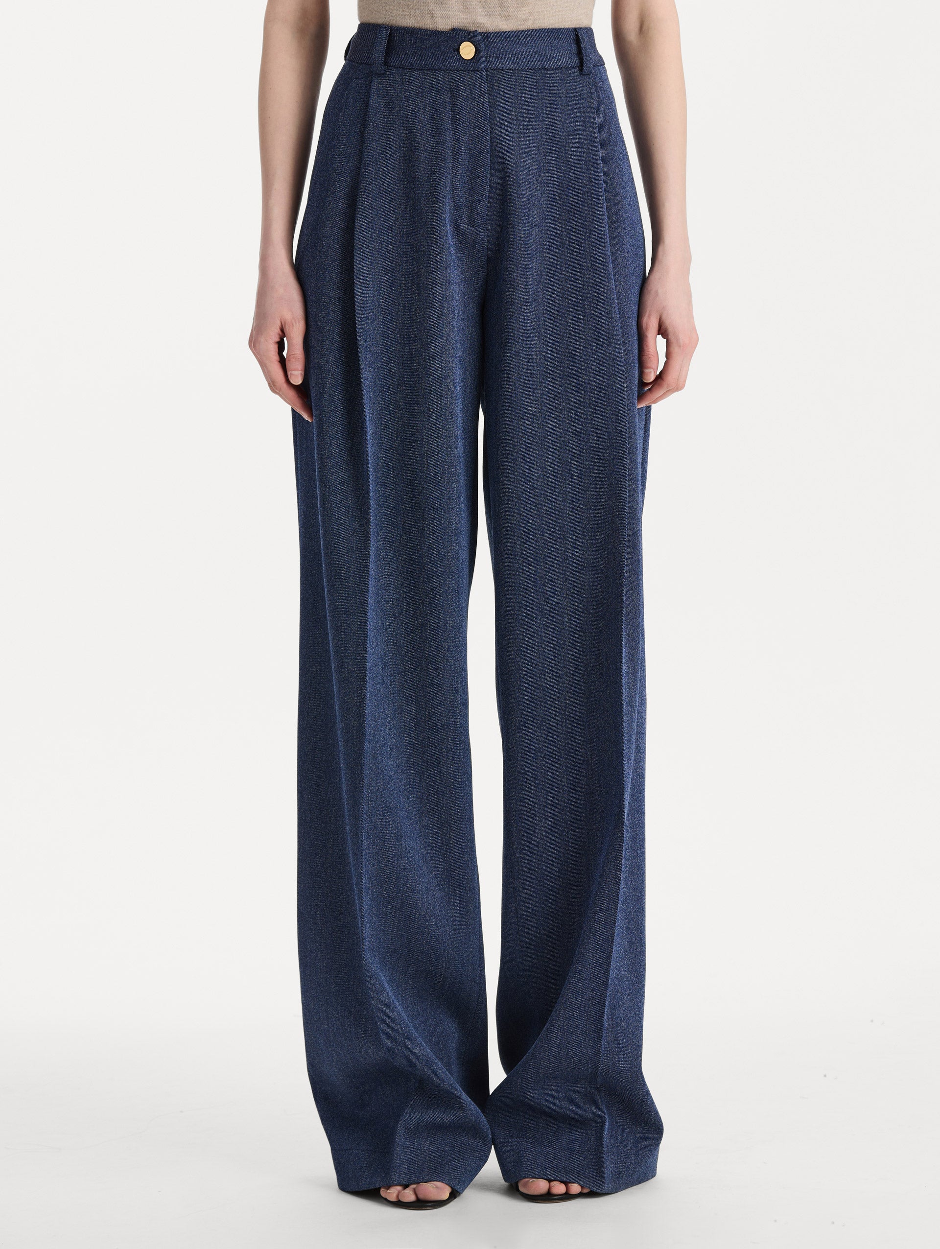 Model wearing indigo wool drill trousers with a straight-leg silhouette. Front view. 