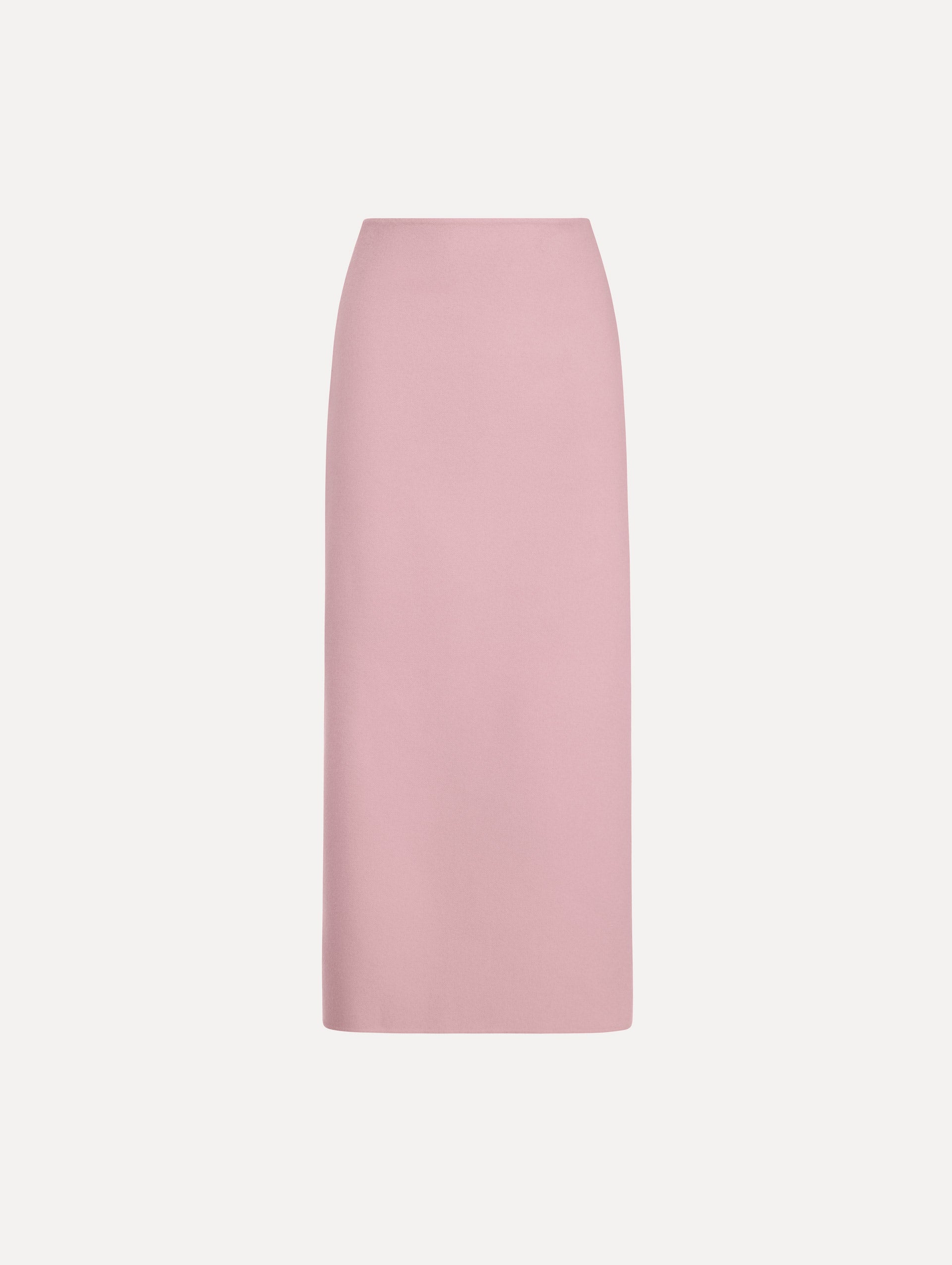 The model is wearing the wool pencil skirt with a structured silhouette in the color blush.