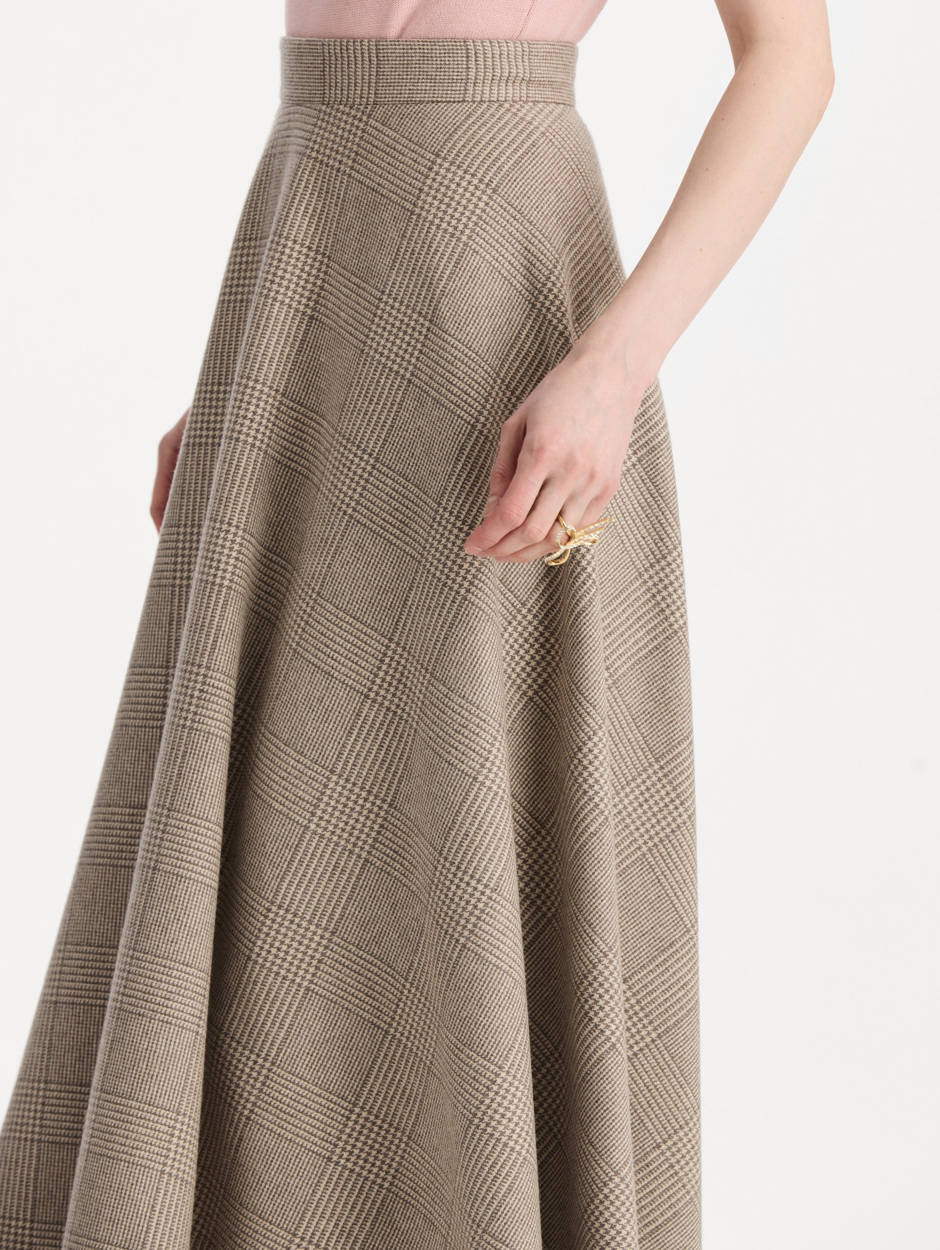 The model is wearing the plaid cashmere-blend skirt with a glen plaid pattern. Zoom view. 