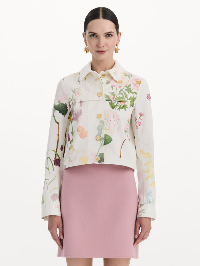 The model is wearing the faded mixed botanical denim jacket in the color white multi. Front view.