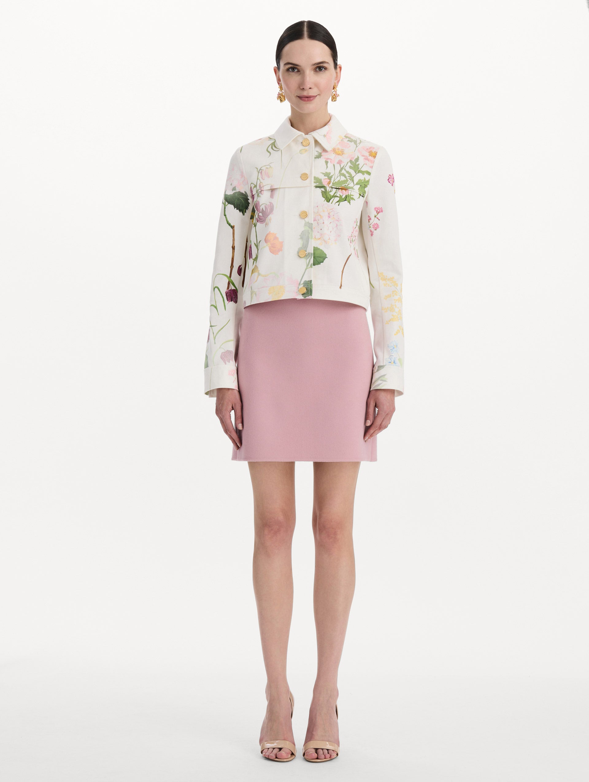 The model is wearing the faded mixed botanical denim jacket in the color white multi. Front view.