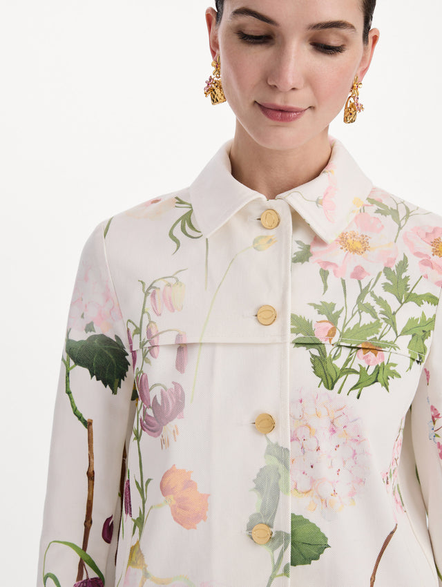 The model is wearing the faded mixed botanical denim jacket in the color white multi. Zoom view.
