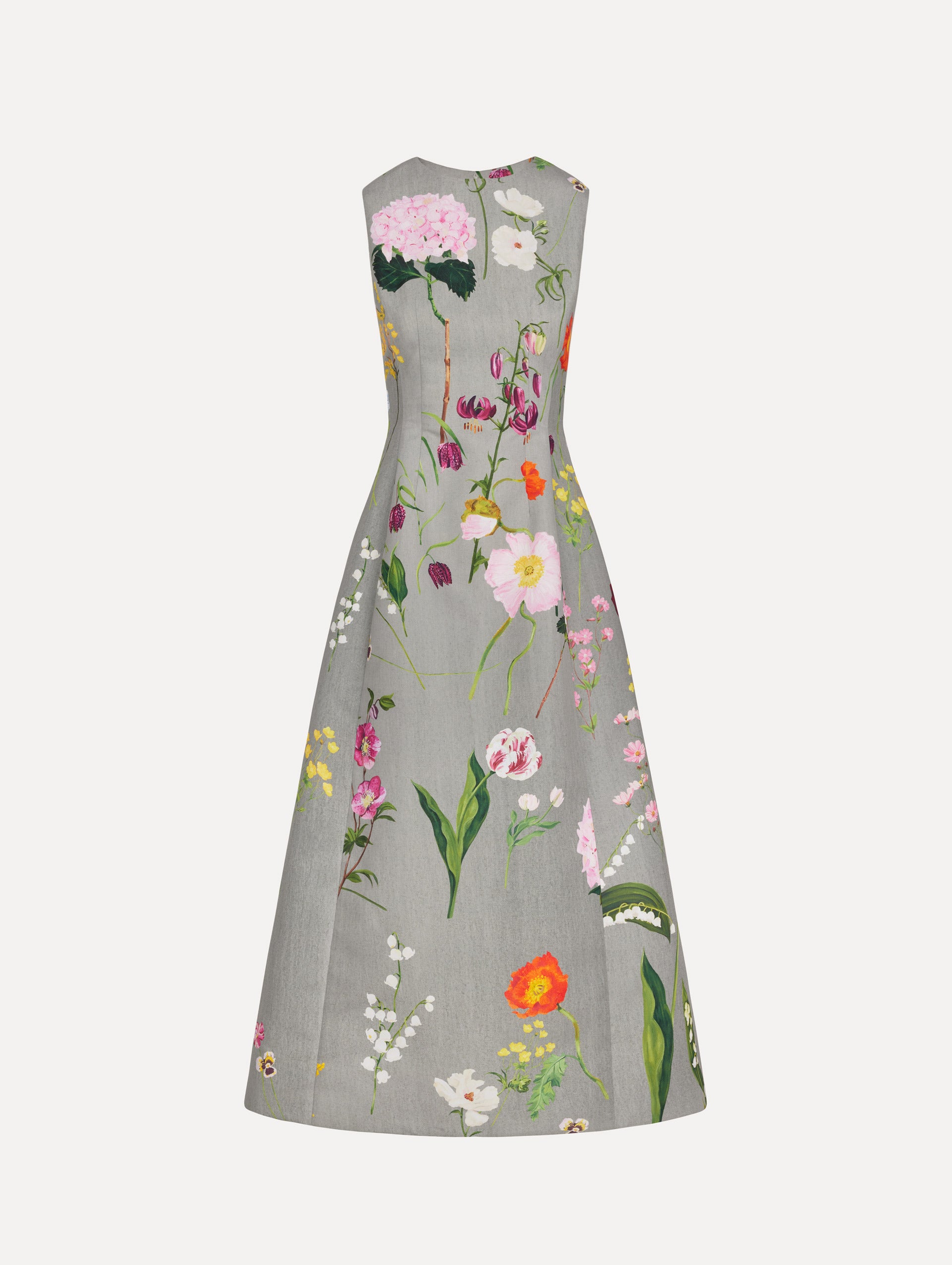 The model is wearing the mixed botanical faille cocktail dress with a sleeveless silhouette in the color grey multi. 