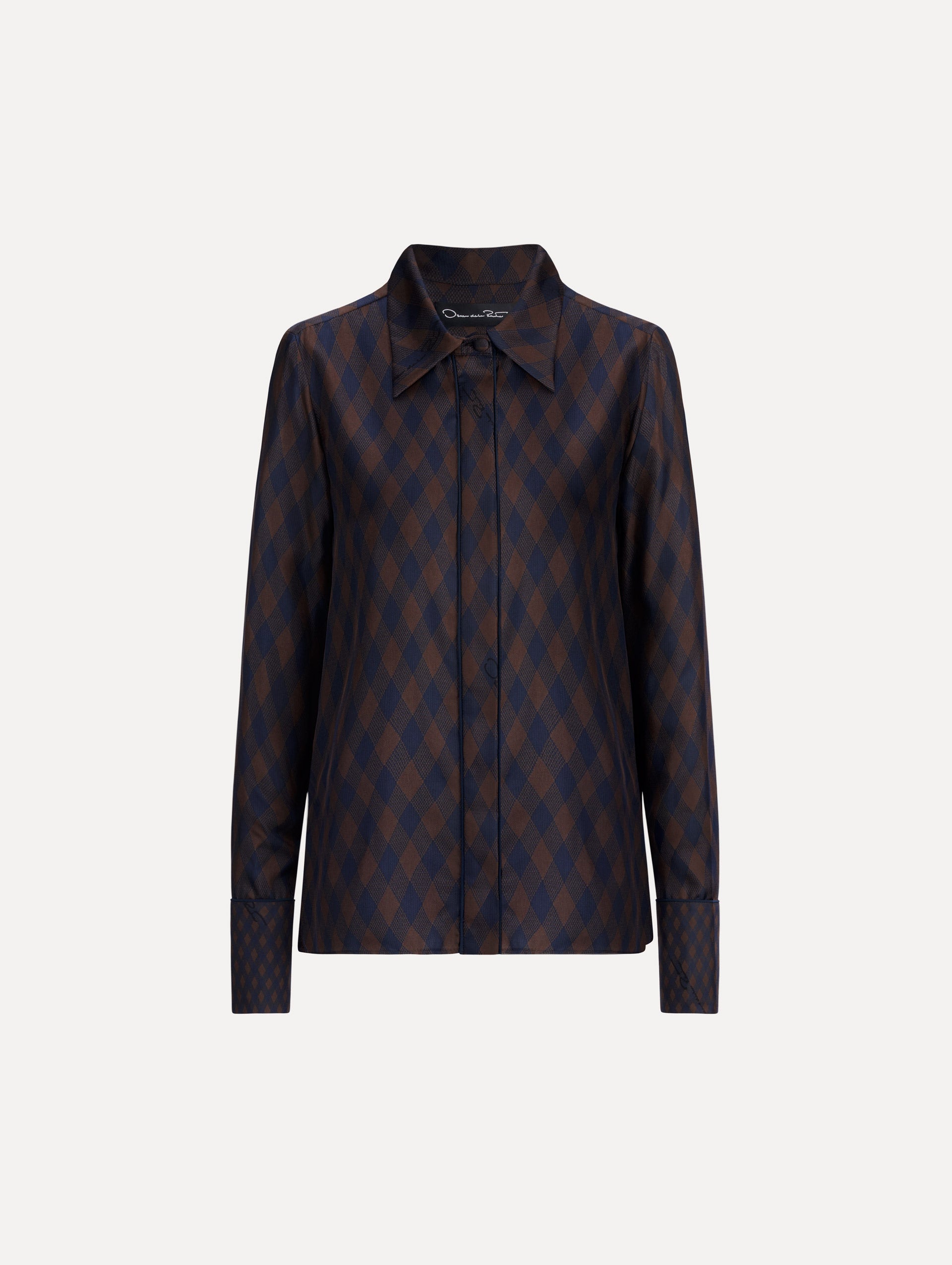 The model is wearing the Argyle Tie-Neck Silk Twill Blouse with long sleeves in navy and brown. 