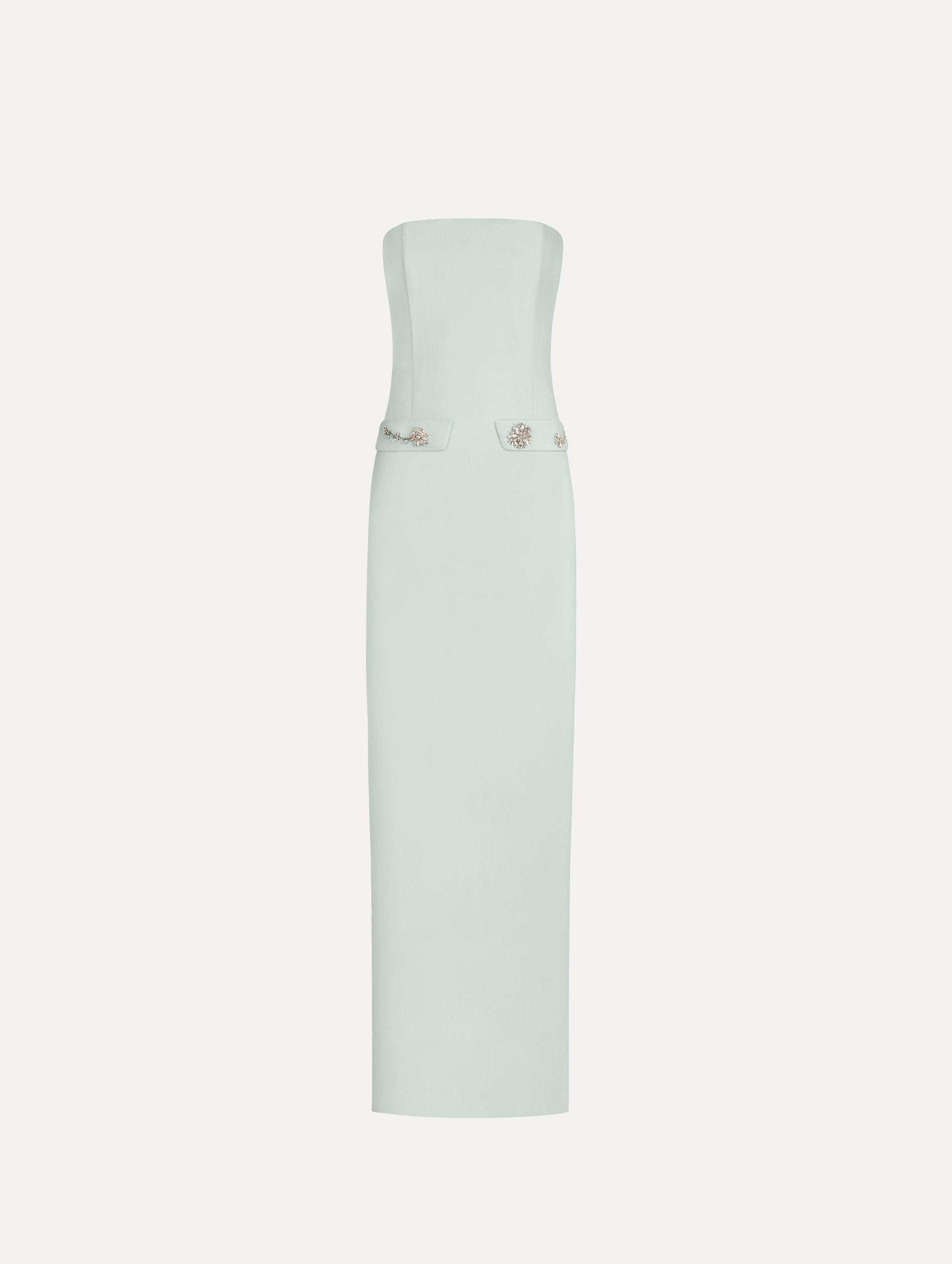 The Crystal Floral Embroidered Gown in Saltwater Blue. Featuring a strapless neckline, faux front flap pockets with crystal embroidery, and a long, column silhouette. Front View.