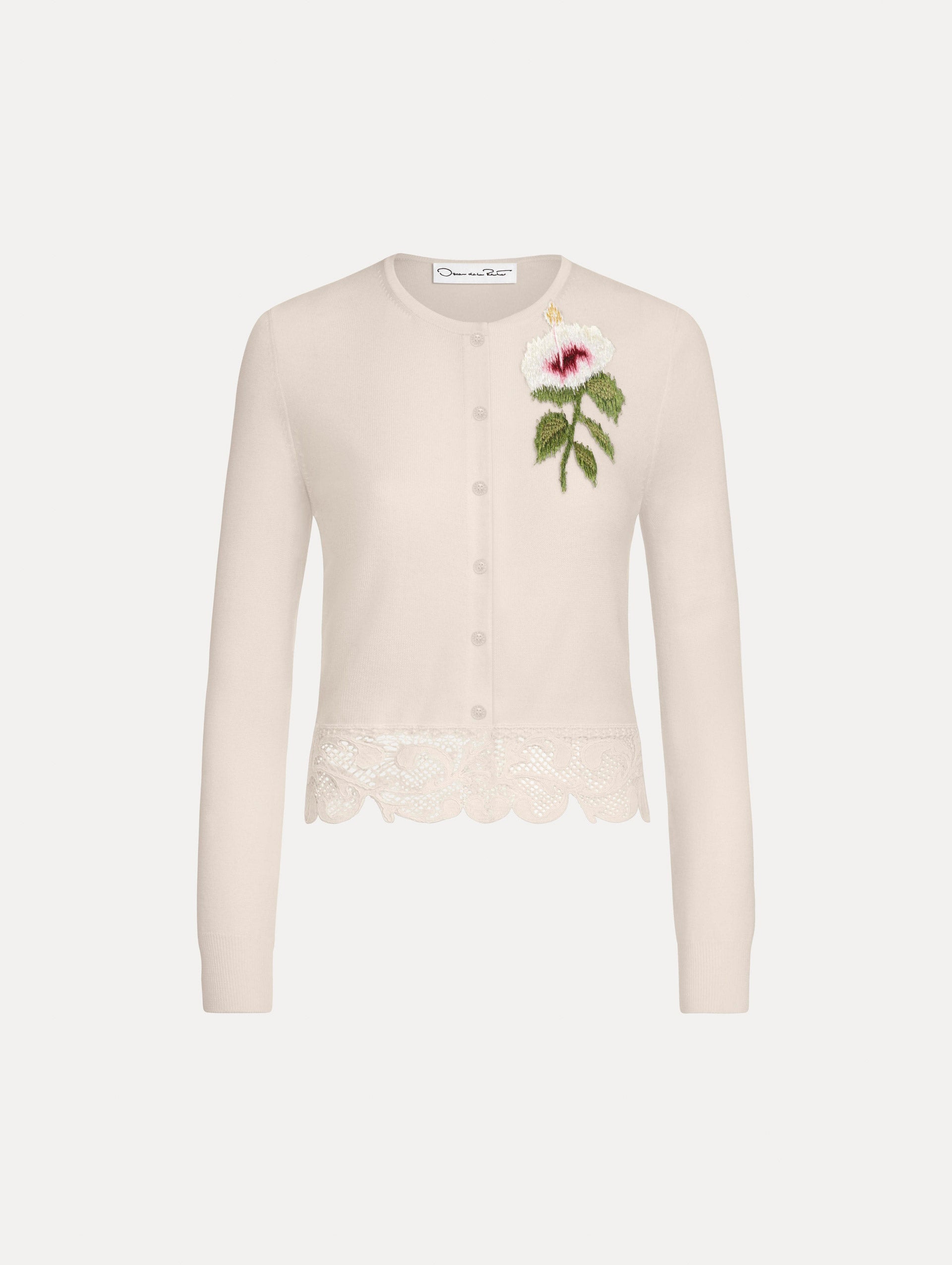 The Chiné Hibiscus Threadwork Cropped Cardigan in Ivory. Featuring a threaded Chiné hibiscus and intricate guipure lace trim. Front View.