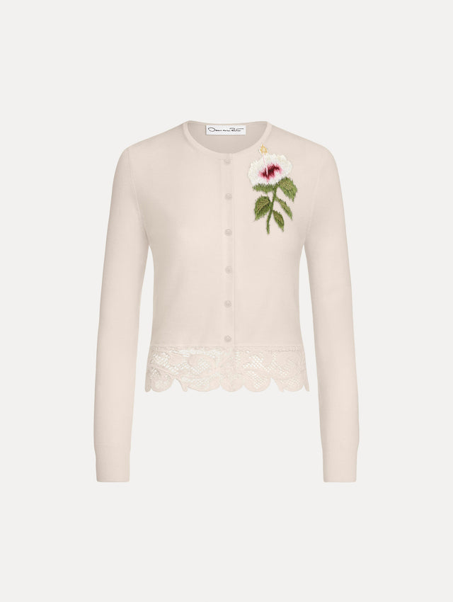 The Chiné Hibiscus Threadwork Cropped Cardigan in Ivory. Featuring a threaded Chiné hibiscus and intricate guipure lace trim. Front View.