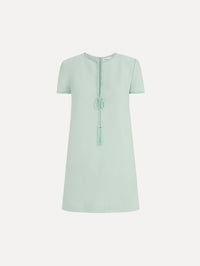 The Beaded Bow-Detail Shift Dress in Saltwater Blue. Featuring a beaded bow detail at the neckline with tassel ties and subtle trim along the edges. Front View.