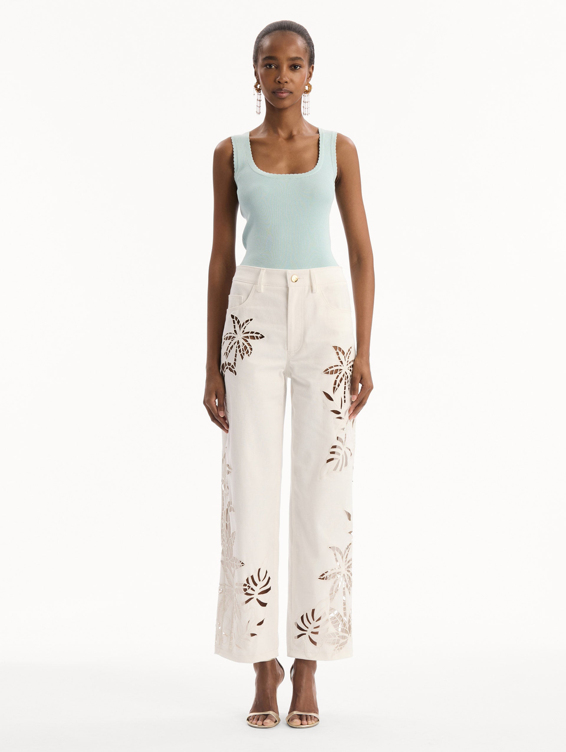 Palm Leaves Cutout Denim Pant in White. front view.