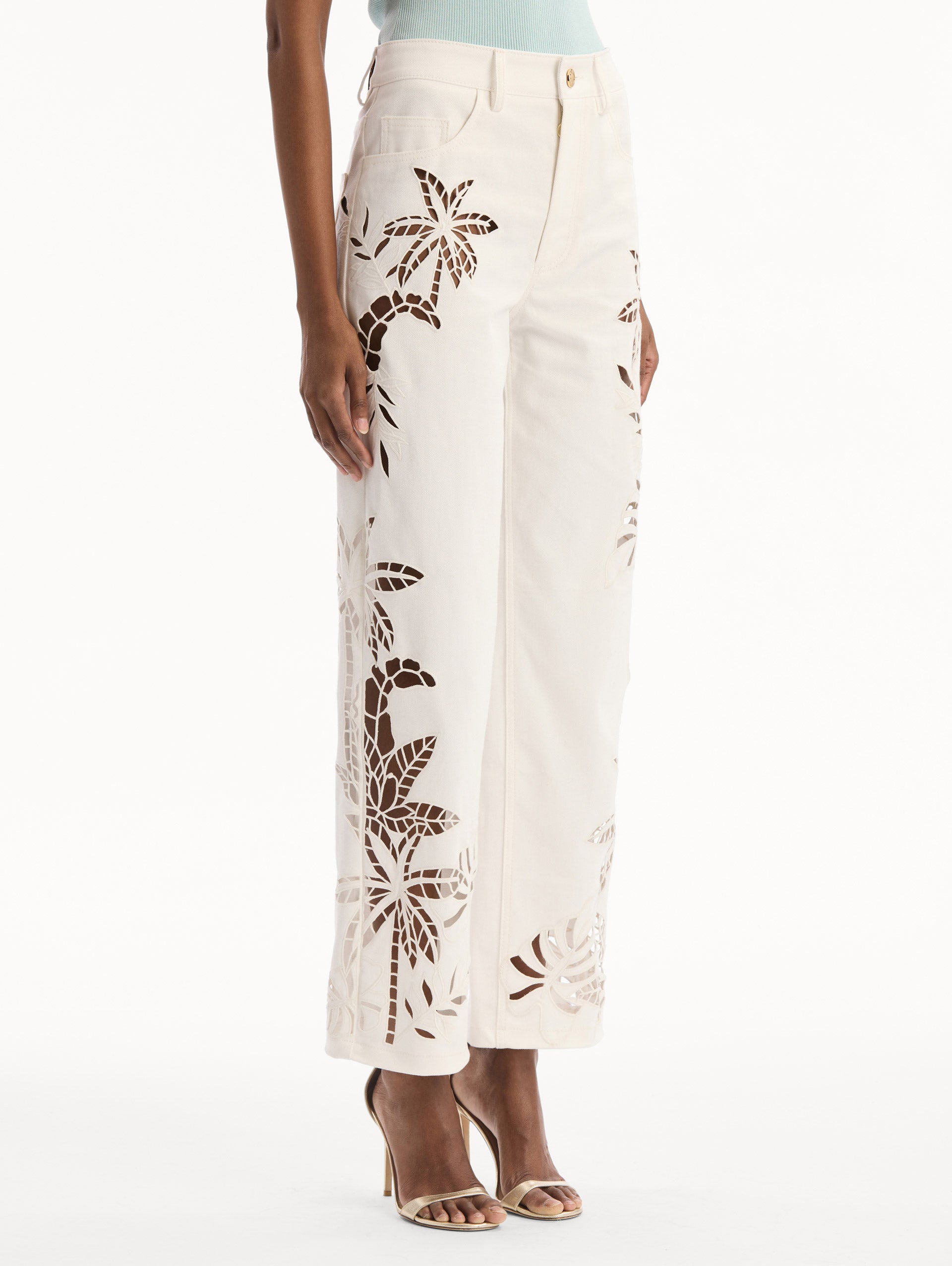 Palm Leaves Cutout Denim Pant in White. side view.