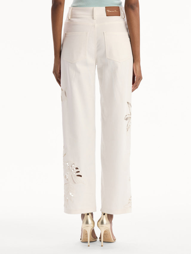 Palm Leaves Cutout Denim Pant in White. back view.