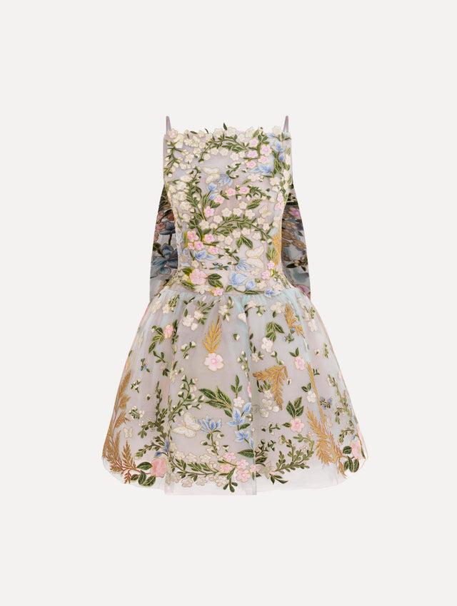 The Dominican Mixed-Floral Guipure Cape-Back Dress. Featuring a straight neckline, fitted bodice, flared mini skirt, and structural cape. Front View.
