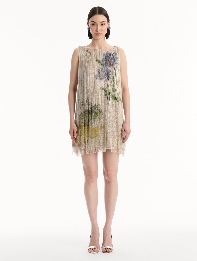 The model is wearing the Chiné Hibiscus Beaded Fringe Shift Dress. Featuring layers of beaded fringe and mini length. Front View.