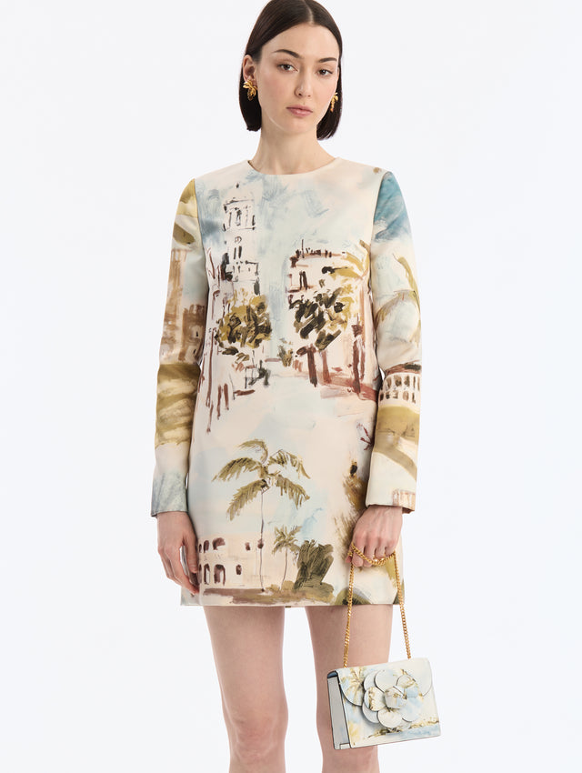 Mini Leather shoulder bag with Dominican Landscape Print. Rectangular with flower closure. Gold Chain strap. Front View.